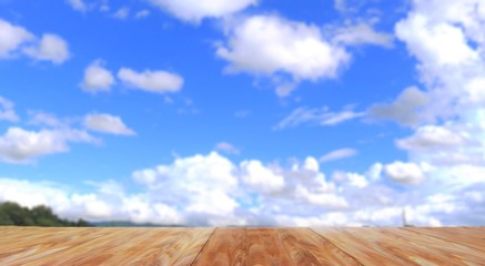 table and wooden whit blur  blue sky background