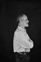 portrait of middle aged man on black