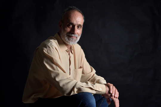 Portrait Of A Man Isolated On Black