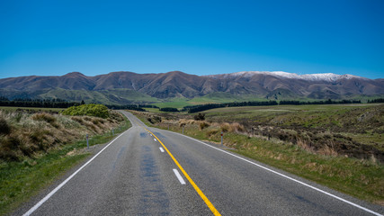 Fototapeta premium Tranquil Street View With Natural Landscape