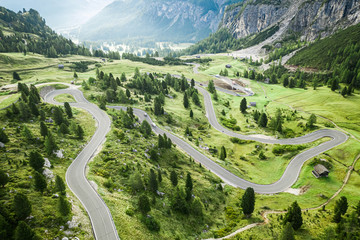 Winding road and green hills, Passo Gardena, Dolomites, aerial view