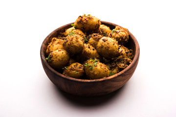 Jeera Aloo - Potatoes Flavoured With Cumin seeds and spices. popular Indian main course recipe. served in a bowl. selective focus