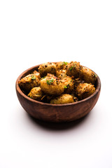 Jeera Aloo - Potatoes Flavoured With Cumin seeds and spices. popular Indian main course recipe. served in a bowl. selective focus