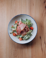 salad with pork, Apple, tomato and cucumber