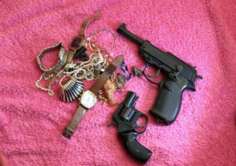 gun and bullets on black background