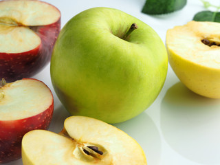 Red, green and yellow apple on a white background