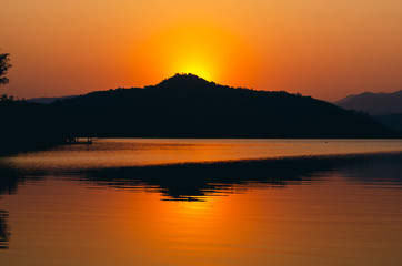 sunset sunrise over river and mountain