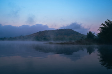 sunset sunrise over river and mountain