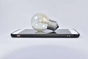 Lamp on smart phone technology idea concept