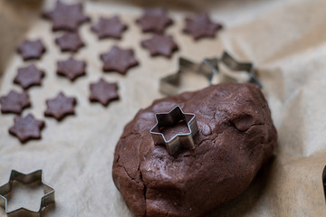 making Christmas butter cookies with cinnamon and chocolate