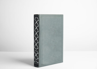 Hardcover book on white background. Space for design