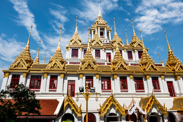 Temple roof in Bangkok Thailand. Blue sky blackgroud.
