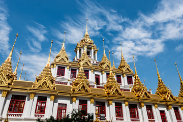 Fototapeta premium Temple roof in Bangkok Thailand. Blue sky blackgroud.