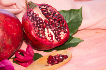 pomegranate fruit on pink background