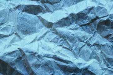 Blue crumpled paper background texture