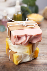 Natural handmade soap bars on wooden table