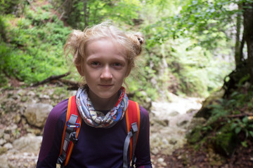 little girl hiker on a path