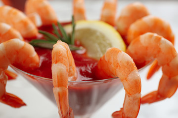 Delicious shrimp cocktail with tomato sauce, closeup