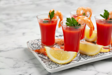 Shrimp cocktail with tomato sauce served on marble table