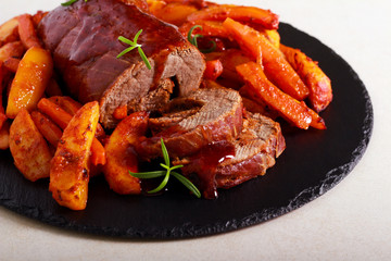 Meat roll with cranberry sauce, potato, carrot