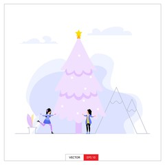 Fototapeta na wymiar two women enjoying the snowfall by playing ice skating under a big Christmas tree