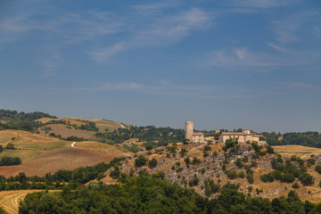 Fototapeta na wymiar Landscape with medieval castle in the surroundings of San Marino, Italy
