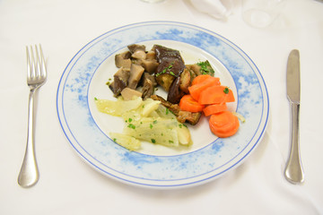 Potatoes, Mushrooms and Carrots in the Plate