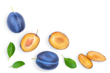 Fototapeta premium fresh blue plum and half with leaves isolated on white background with copy space for your text. Top view. Flat lay