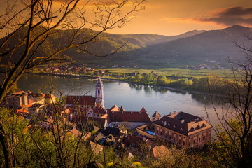 Panoramic view of Wachau valley with the historic town of Durnstein. Danube river in evening light...