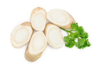 Horseradish root slices and parsley isolated on white background. Top view. Flat lay