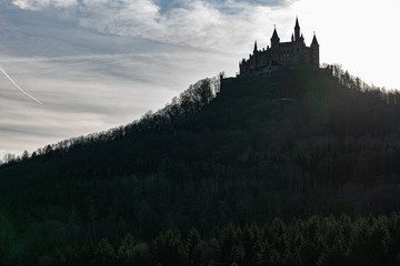 Hilltop castle of Hohenzollern in Germany with sun behind