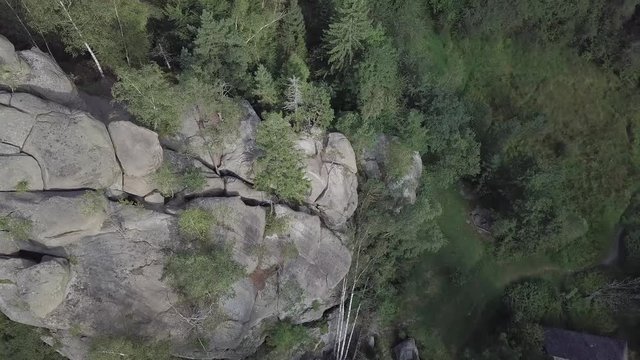 Aerial view stone rocks Ternoshorska Lada amidst beautiful scenic Carpathian mountains and forest. Symbol of motherhood and fertility, Kosiv Region, Ivano-Frankivsk Oblast, Ukraine