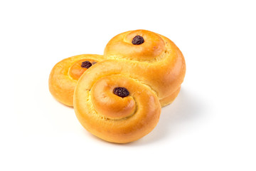Two traditional Swedish and scandinavian Christmas saffron buns Lussekatter, isolated on white background, horizontal