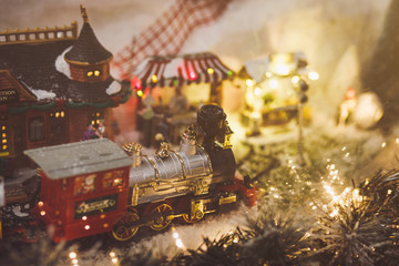 Miniature Christmas train model with steam engine