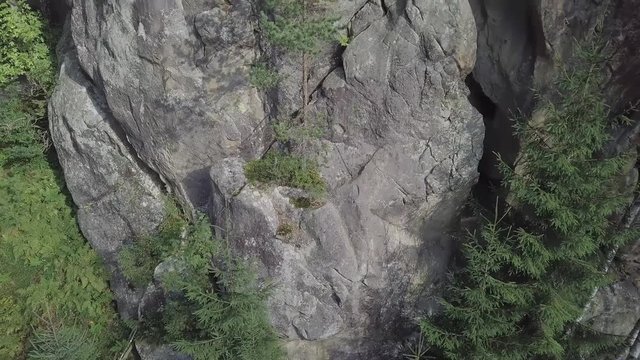 Aerial view stone rocks Ternoshorska Lada amidst beautiful scenic Carpathian mountains and forest. Symbol of motherhood and fertility, Kosiv Region, Ivano-Frankivsk Oblast, Ukraine