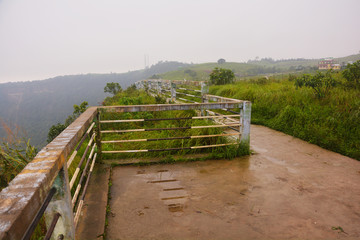 Close up of the railings of Cherrapunjee Eco Park made of concrete pillars and steel pipes, and...