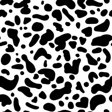 Seamless vector animal pattern. Hand drawn black isolated spots . Random spots similar to the color of the animal. Stylized Dalmatian, cow, cheetah, leopard print. Ornament for textile, clothes
