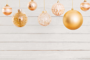 Christmas balls hanging  on  white wooden background