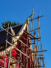 buddhist prayer flags on roof of temple