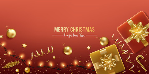 Christmas background. Merry Christmas and happy new year. Red gift box with gold self adhesive bow, pine and confetti on a red background.