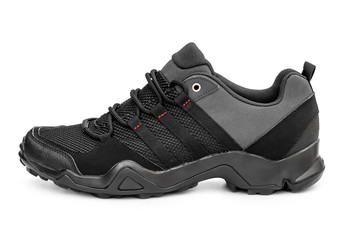 Single black sneaker on white.