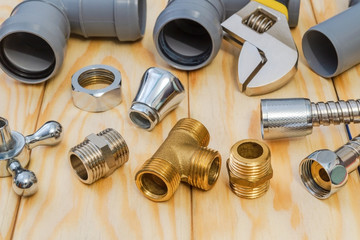 Spare parts and accessories for plumbing repair on a wooden boards