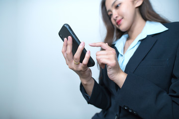 Business woman use smartphone typing a message