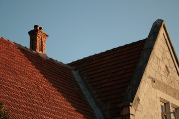 old tiled roof with chimney