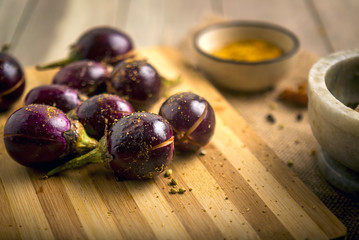 Preparation of stuffed masala baingan or eggplant - an indian recipie
