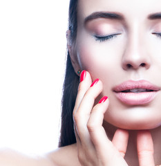 Close-up beauty face, model woman, perfect skin, hand near cheek, natural makeup, nude lipstick, closed eyes. Isolated. White background