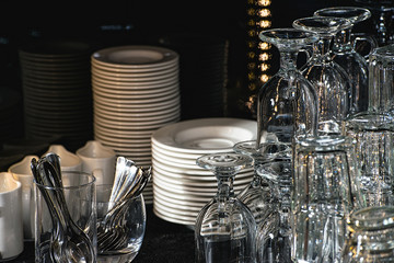 Glasses for a margarita, martini, grog and liqueur on a bar at restaurant, against the bar bar wall background.