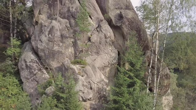 Aerial view stone rocks Ternoshorska Lada amidst beautiful scenic Carpathian mountains and forest. Symbol of motherhood and fertility, Kosiv Region, Ivano-Frankivsk Oblast, Ukraine