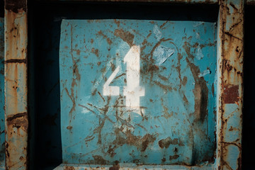 number 4 (four) painted on vintage metal background -