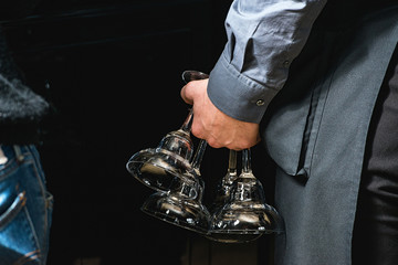waiter holding a glass for wine